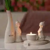 Laden Sie das Bild in den Galerie-Viewer, Tiziano Lilly auf Blatt mit Teelicht 15,5 cm weiss creme